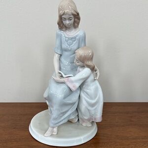 Graceful Ceramic Family Sculpture in Soft Hues